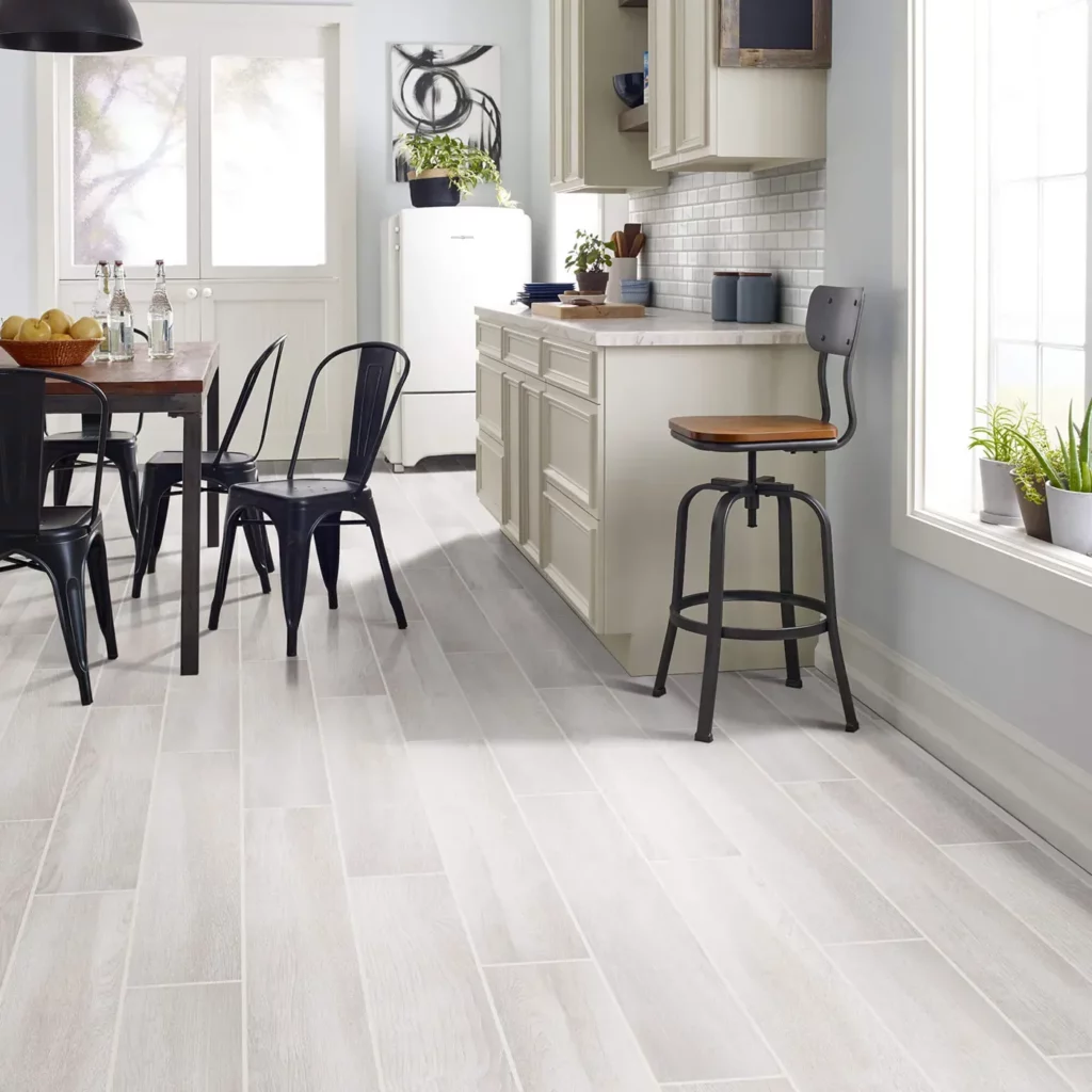 Shaw Floors light wood look tile in a kitchen | Hadinger Flooring