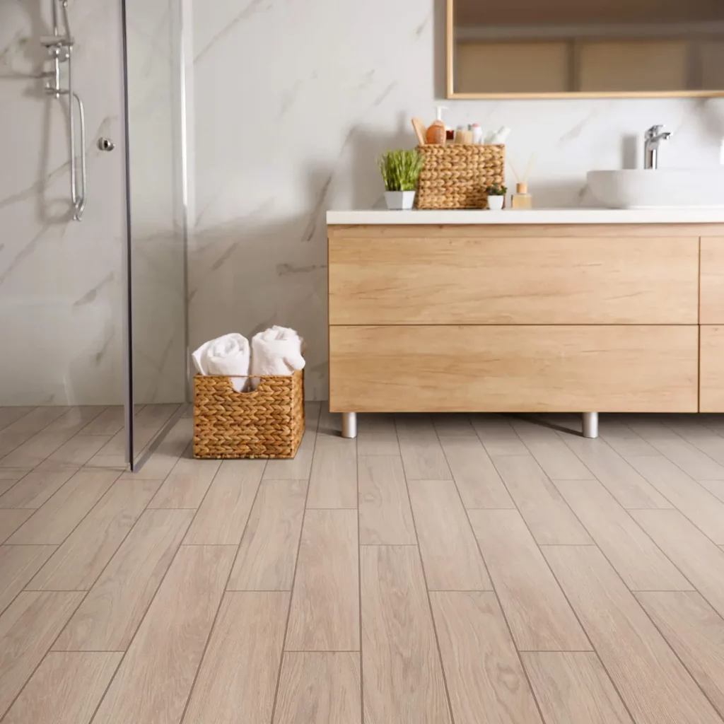 Shaw Floors tile with a light wood look, in a modern bathroom | Hadinger Flooring