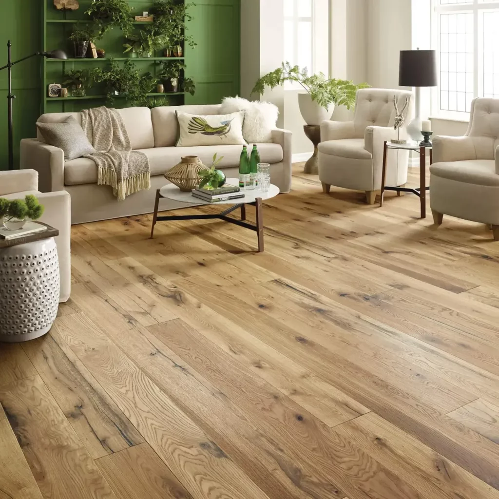Gray-brown hardwood in a dining room with a dark wood table | Hadinger Flooring
