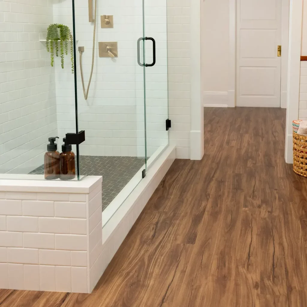 COREtec Luxury Vinyl in a medium brown wood tone in a living room | Hadinger Flooring