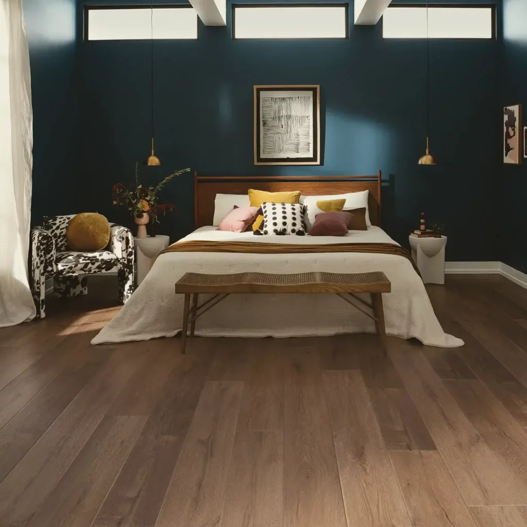 COREtec Luxury Vinyl in a medium brown wood tone in a bedroom | Hadinger Flooring